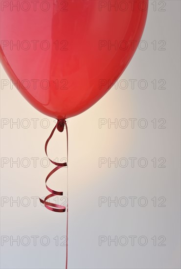 Red balloon and ribbon.