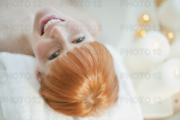 Woman relaxing in bathtub.