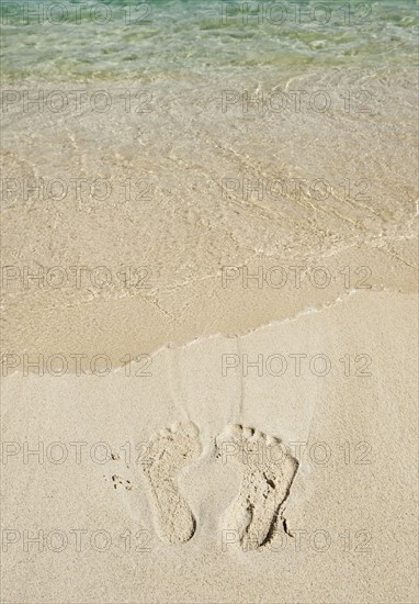 Footprints in sand.