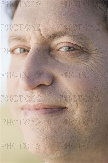 Close up of mature businessman. Photographe : PT Images