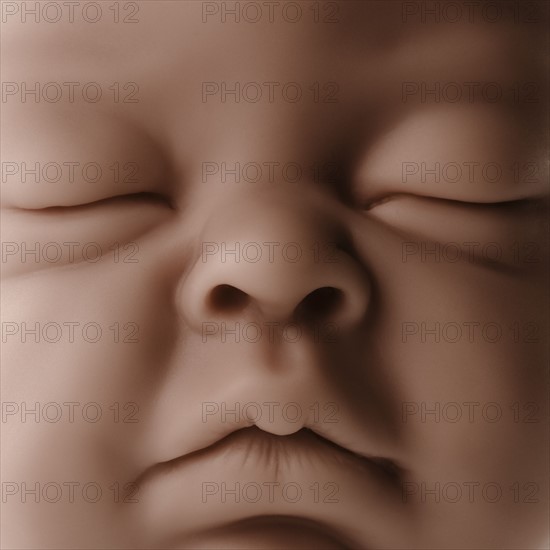 Close up of baby doll face. Photographe : Joe Clark