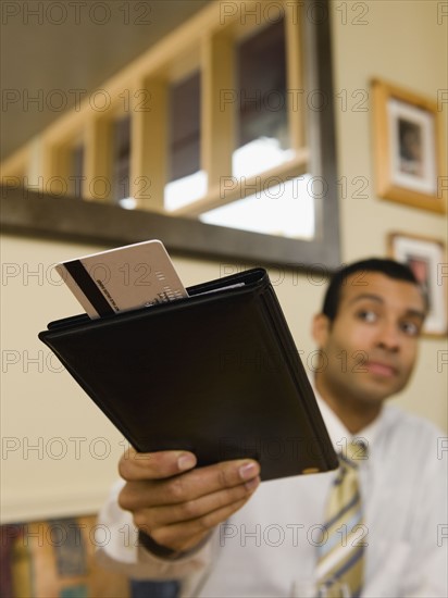 Man paying bill in restaurant.