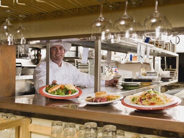 Chef in restaurant kitchen.