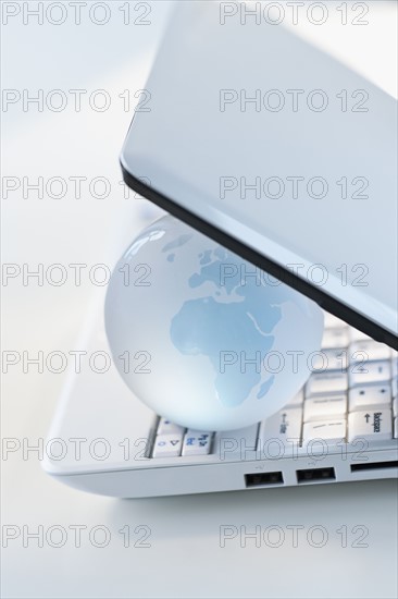 Globe inside laptop.