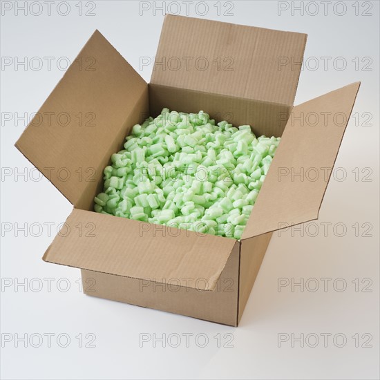 Packing peanuts in cardboard box.