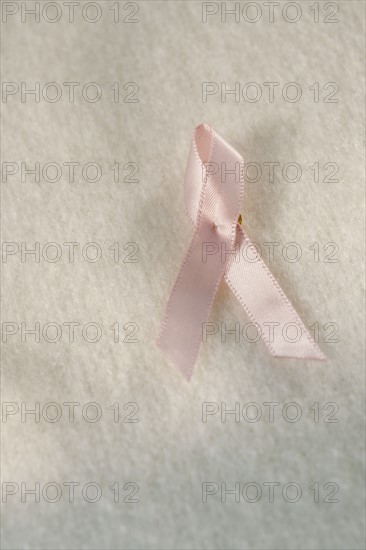 Close up of breast cancer ribbon.