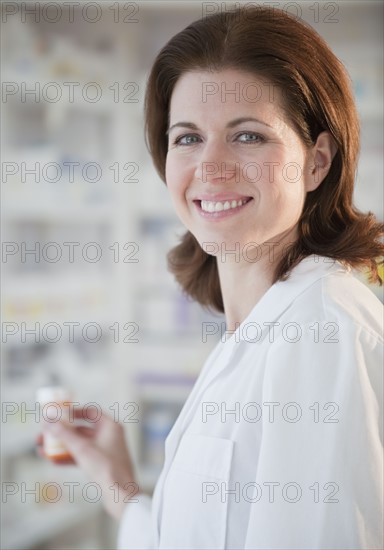 Pharmacist filling prescription.
