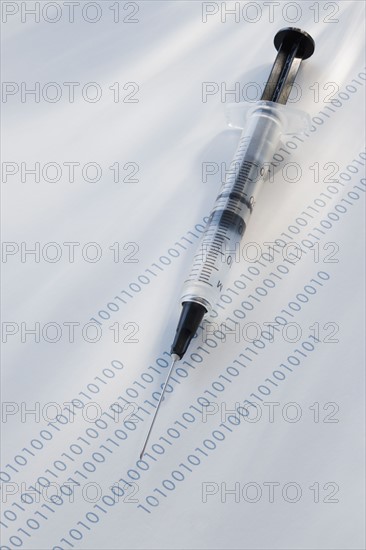 Syringe on binary code.