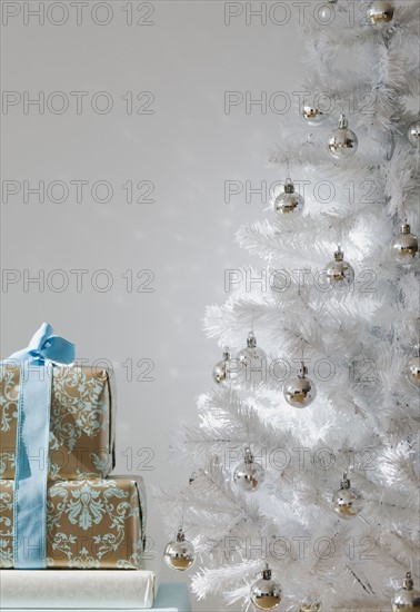 Gifts and white Christmas tree.