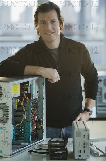 Technician repairing computer.