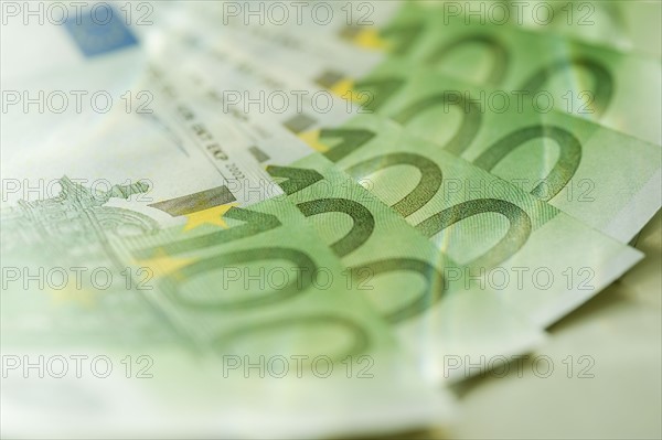 100 euro notes spread out.