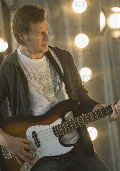 Man playing electric guitar.