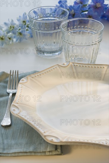 Tropical flowers and placesetting.