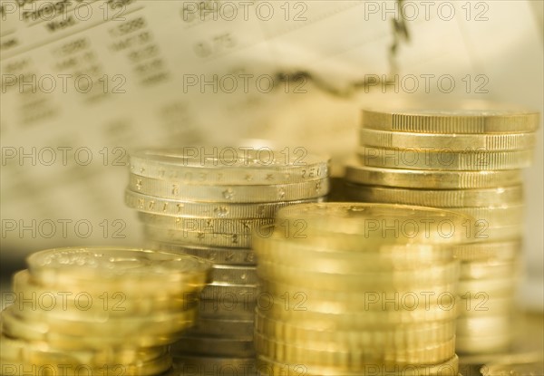 Stacks of euro coins and exchange rates.