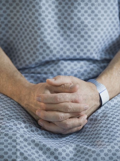 Man in hospital gown.