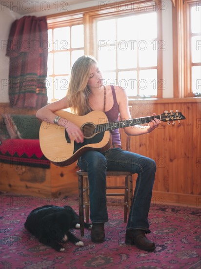 Young woman playing guitar