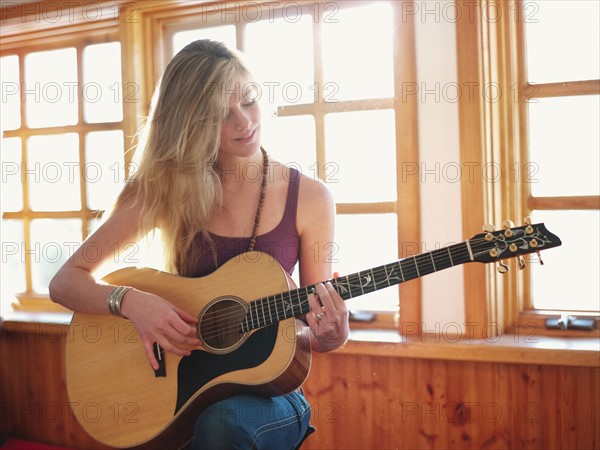 Young woman playing guitar