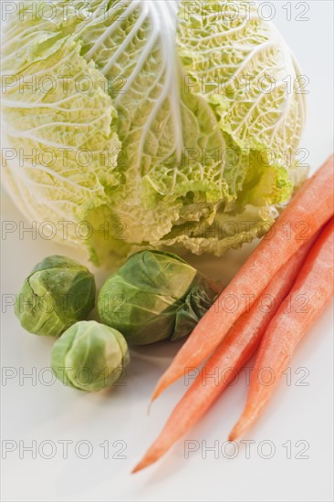 Bunch of carrots, brussel sprouts and cabbage.