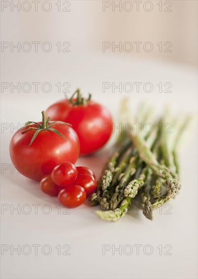 Tomatoes and bunch of asparagus.