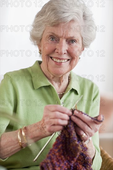 Senior woman knitting.