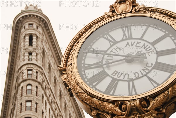 Flatiron Building and clock, Manhattan, New York City, New York, USA.