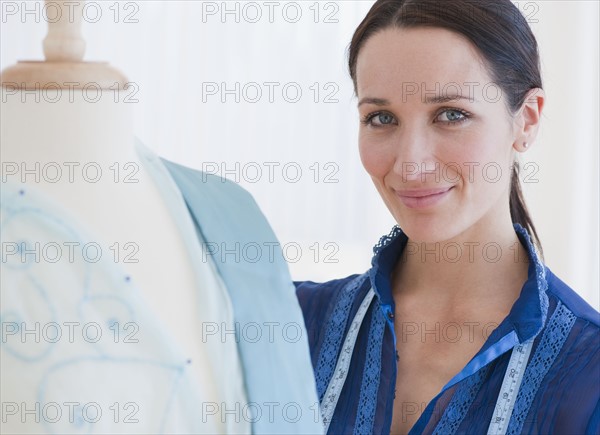 Female tailor at work, portrait.