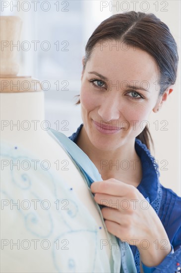 Female tailor at work, portrait.