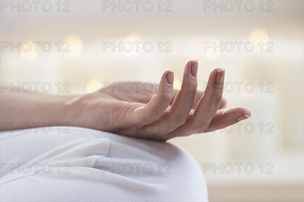 Close-up of woman's hand knee.