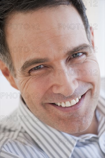 Portrait of successful mature businessman smiling.