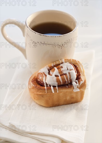 cinnamon bun with coffee.