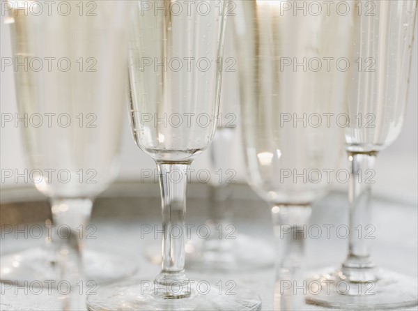 Glasses of champagne, close-up, still life. Photographe : Jamie Grill