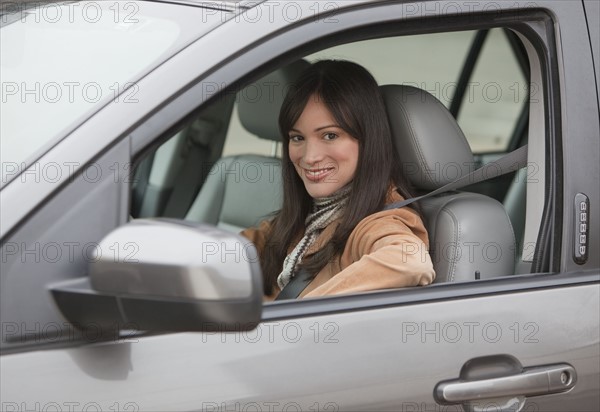 Portrait of woman driving car.