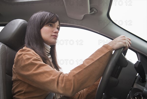 Woman driving car.