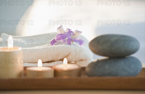 Rocks and candles on tray.