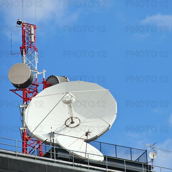Microwave tower with satellite dish, New York City, New York, USA.