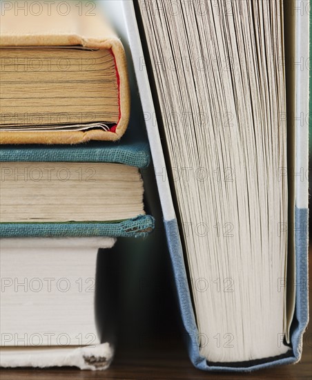 Close-up of books, studio shot. Photographe : Jamie Grill