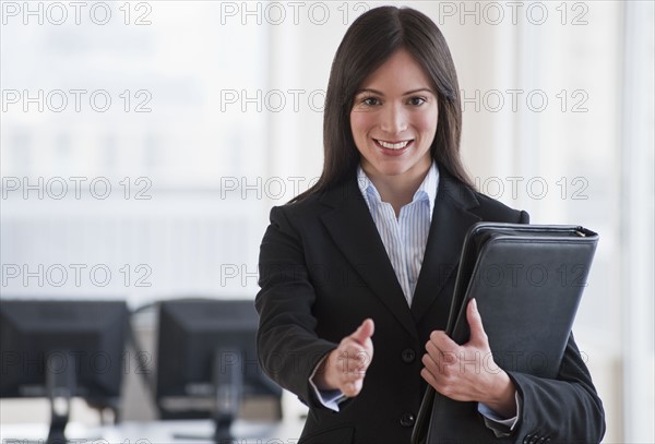 Businesswoman ready to shake hands.