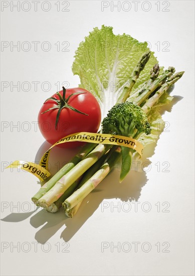 Bunch of organically grown vegetables wrapped with tape.