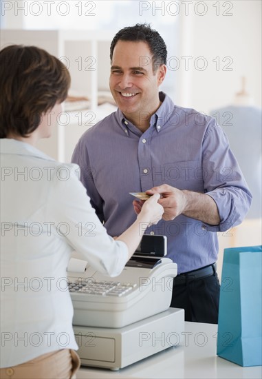 Man paying in store.