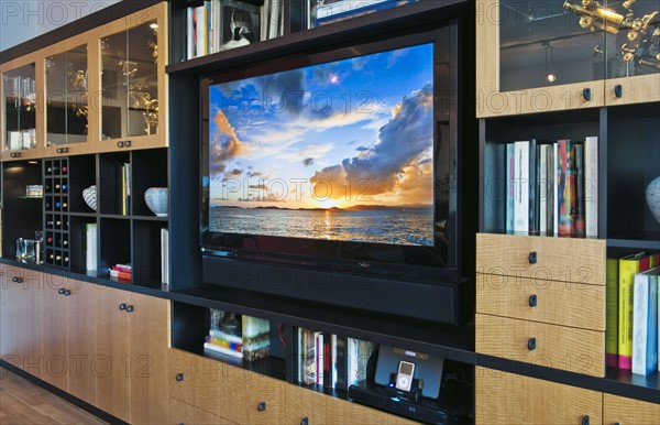 Flat screen TV in luxurious apartment.