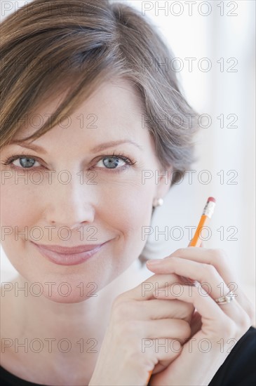 Portrait of successful mature businesswoman, smiling.