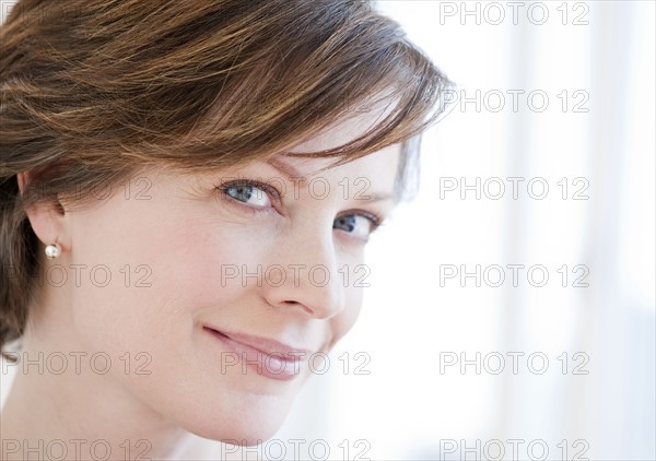 Portrait of successful mature businesswoman, smiling.