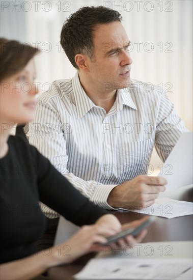 Mature businessman and businesswoman on business meeting.