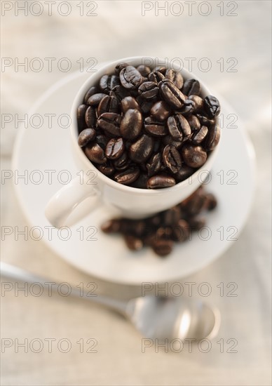 Coffee beans in cup.