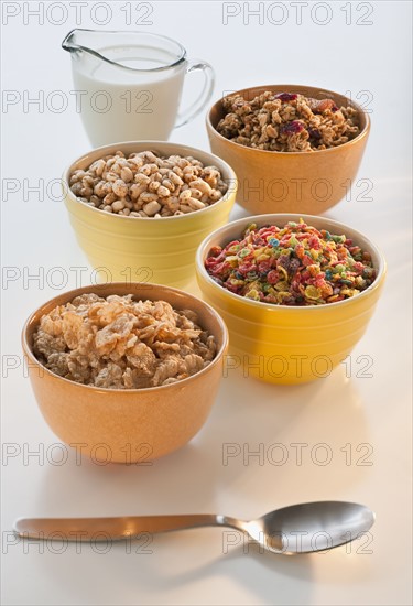 Studio shot of Whole grains, cereal, puffed rice, corn puffs, granola, flakes.