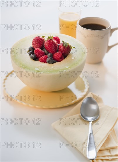 Studio shot of yogurt with fruits.