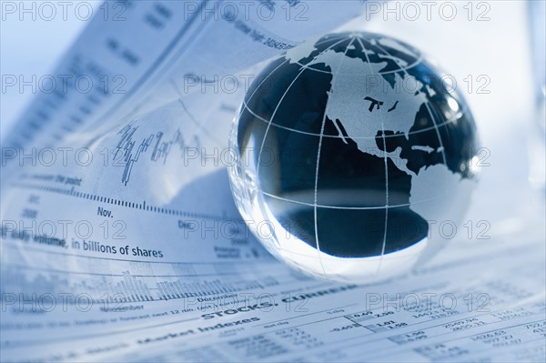 A globe on business papers.