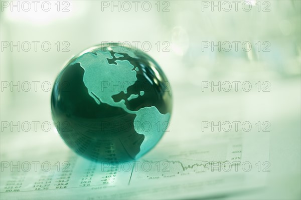 A globe on business papers.