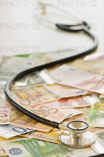 Stethoscope on bank notes