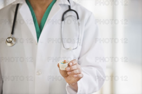 A doctor holding some medication